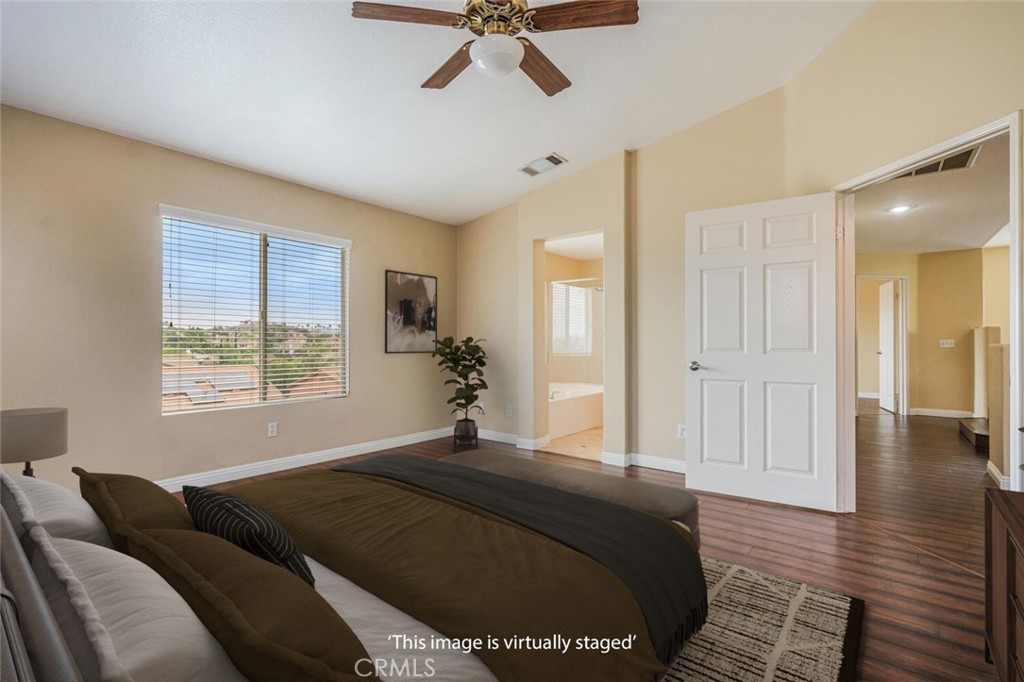 17262 Hawkwood Drive Riverside, CA 92503 - Photo 17 of 33 a bedroom with a bed and window
