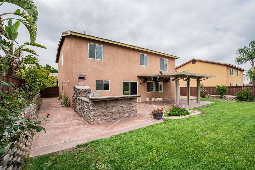 17262 Hawkwood Drive Riverside, CA 92503 - Photo 24 of 33 a front view of a house with a garden and porch