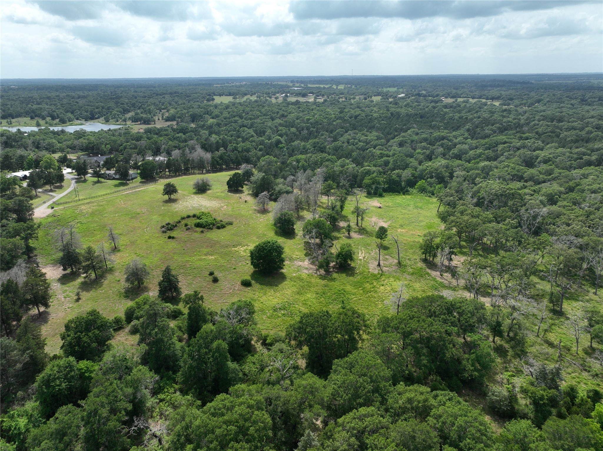17718 Tranquil Lane Cat Spring, TX 78933 - Photo 12 of 13 an aerial view of residential houses with outdoor space and trees