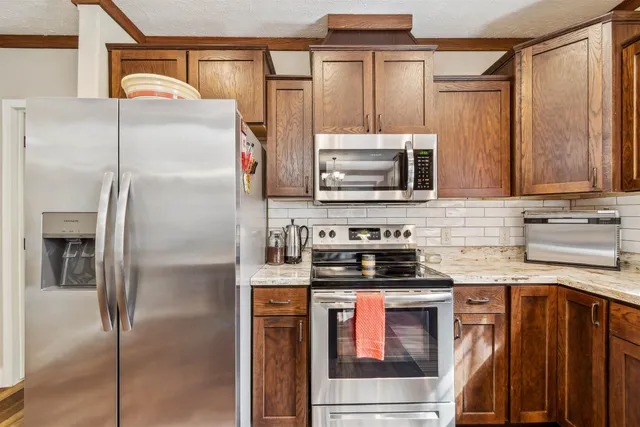 a living room with furniture and large windows