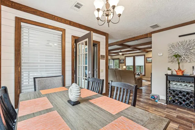 a bathroom with a tub double vanity sink and mirror