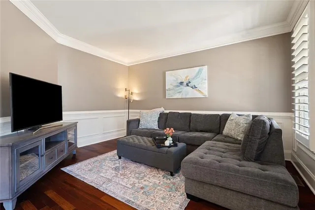 a kitchen with stainless steel appliances kitchen island granite countertop a refrigerator and a stove top oven