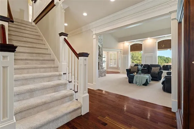 a kitchen with granite countertop a sink cabinets and wooden floor
