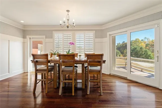 a spacious bedroom with a bed and a chandelier