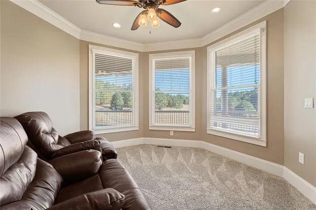a view of balcony with chairs and wooden floor