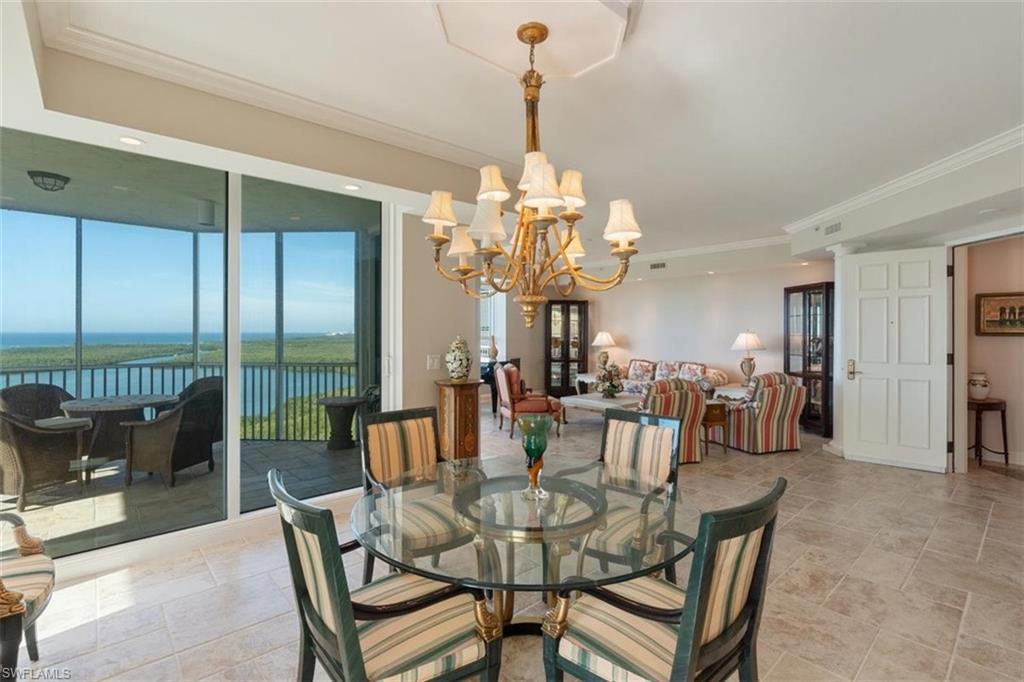 285 Grande Way, Unit 1501 Naples, FL 34110 - Photo 12 of 35 a view of a dining room with furniture window and outside view