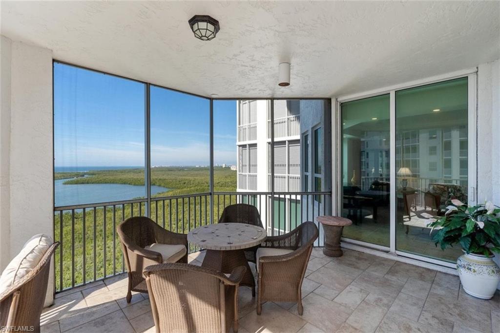 285 Grande Way, Unit 1501 Naples, FL 34110 - Photo 13 of 35 a view of a dining room with furniture window and outside view