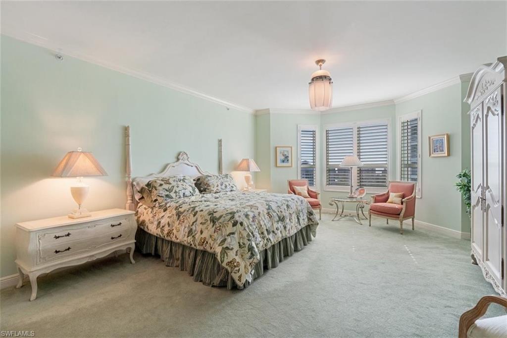 285 Grande Way, Unit 1501 Naples, FL 34110 - Photo 17 of 35 a bedroom with bed and a window