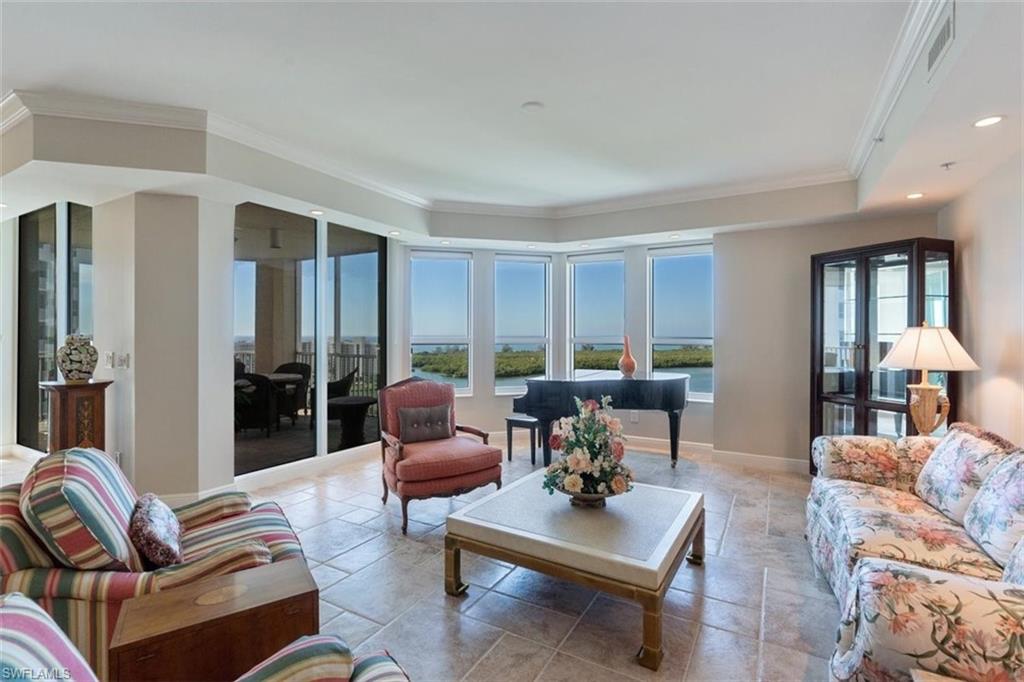 285 Grande Way, Unit 1501 Naples, FL 34110 - Photo 2 of 35 a living room with furniture and a large window