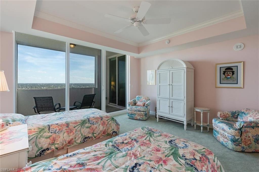 285 Grande Way, Unit 1501 Naples, FL 34110 - Photo 21 of 35 a bed room with a bed and a couch