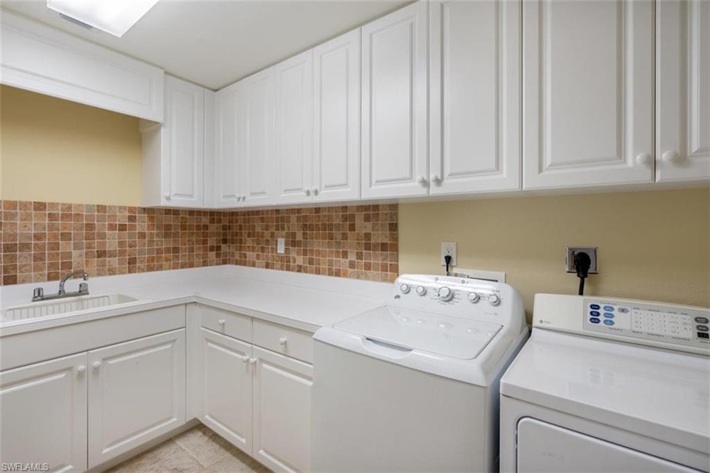 285 Grande Way, Unit 1501 Naples, FL 34110 - Photo 29 of 35 a utility room with dryer and washer