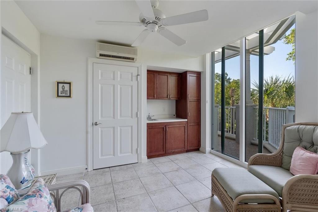 285 Grande Way, Unit 1501 Naples, FL 34110 - Photo 30 of 35 a living room with furniture and a large window