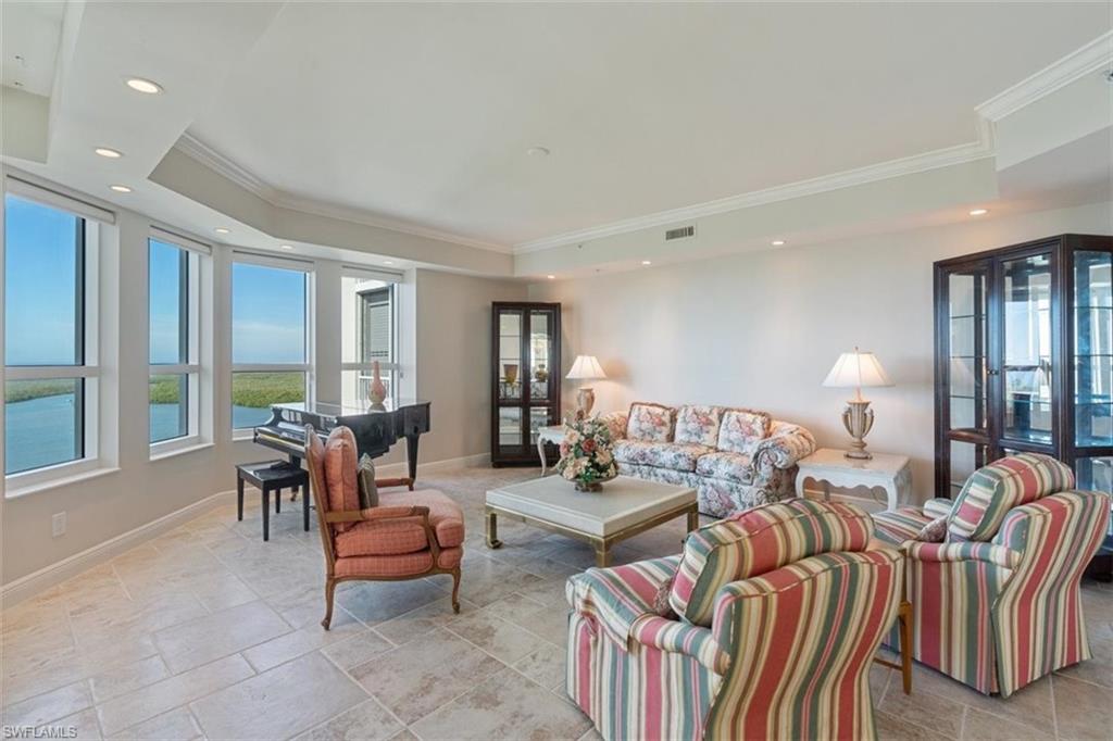 285 Grande Way, Unit 1501 Naples, FL 34110 - Photo 3 of 35 a living room with furniture and a large window