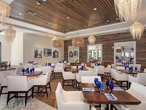 285 Grande Way, Unit 1501 Naples, FL 34110 - Photo 35 of 35 a view of a dining room with furniture