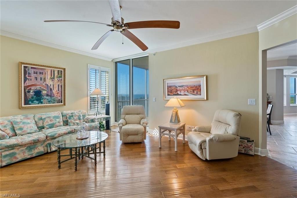 285 Grande Way, Unit 1501 Naples, FL 34110 - Photo 9 of 35 a living room with furniture and wooden floor