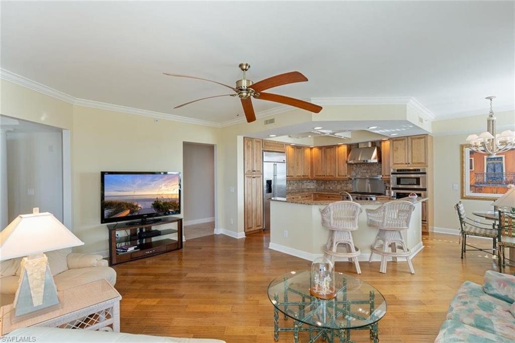285 Grande Way, Unit 1501 Naples, FL 34110 - Photo 10 of 35 a living room with furniture and a flat screen tv