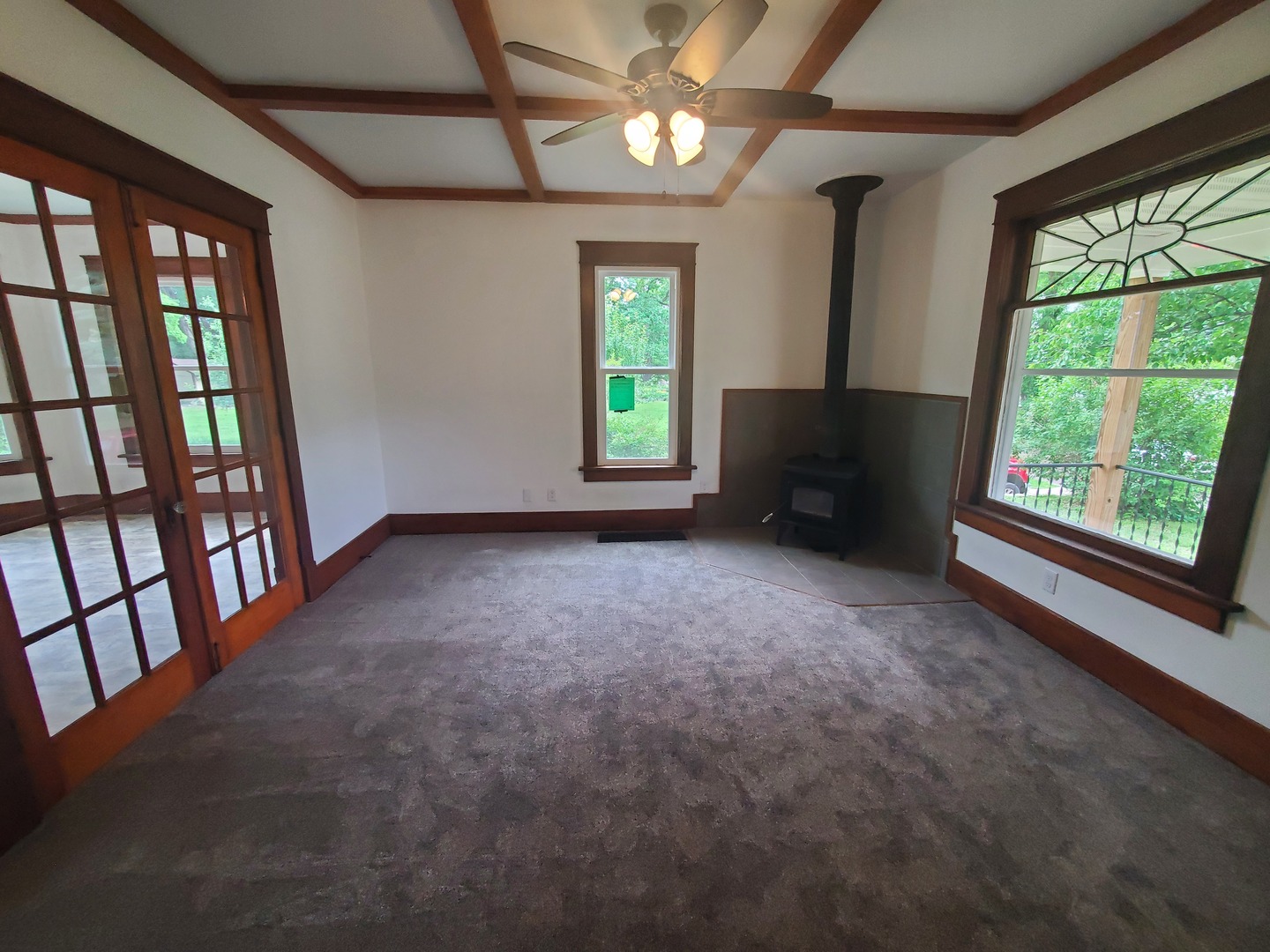 712 3rd Street Moline, IL 61265 - Photo 13 of 29 an empty room with windows and book shelf