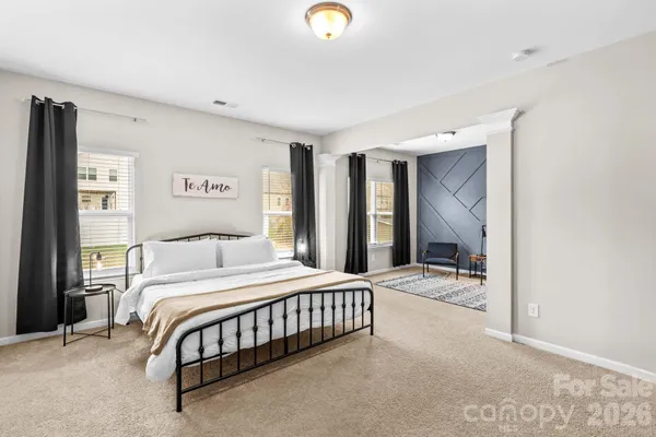 a bedroom with a bed and a cabinets