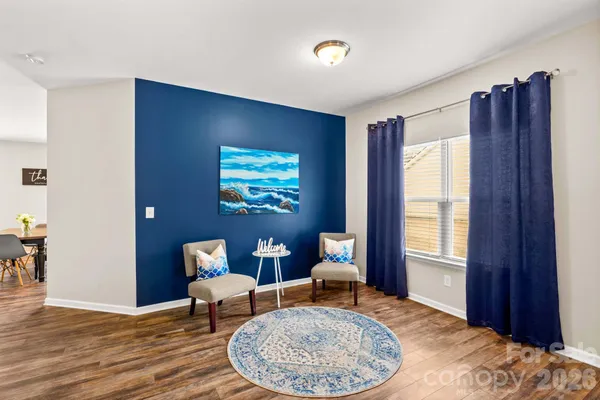 a bedroom with furniture and a window