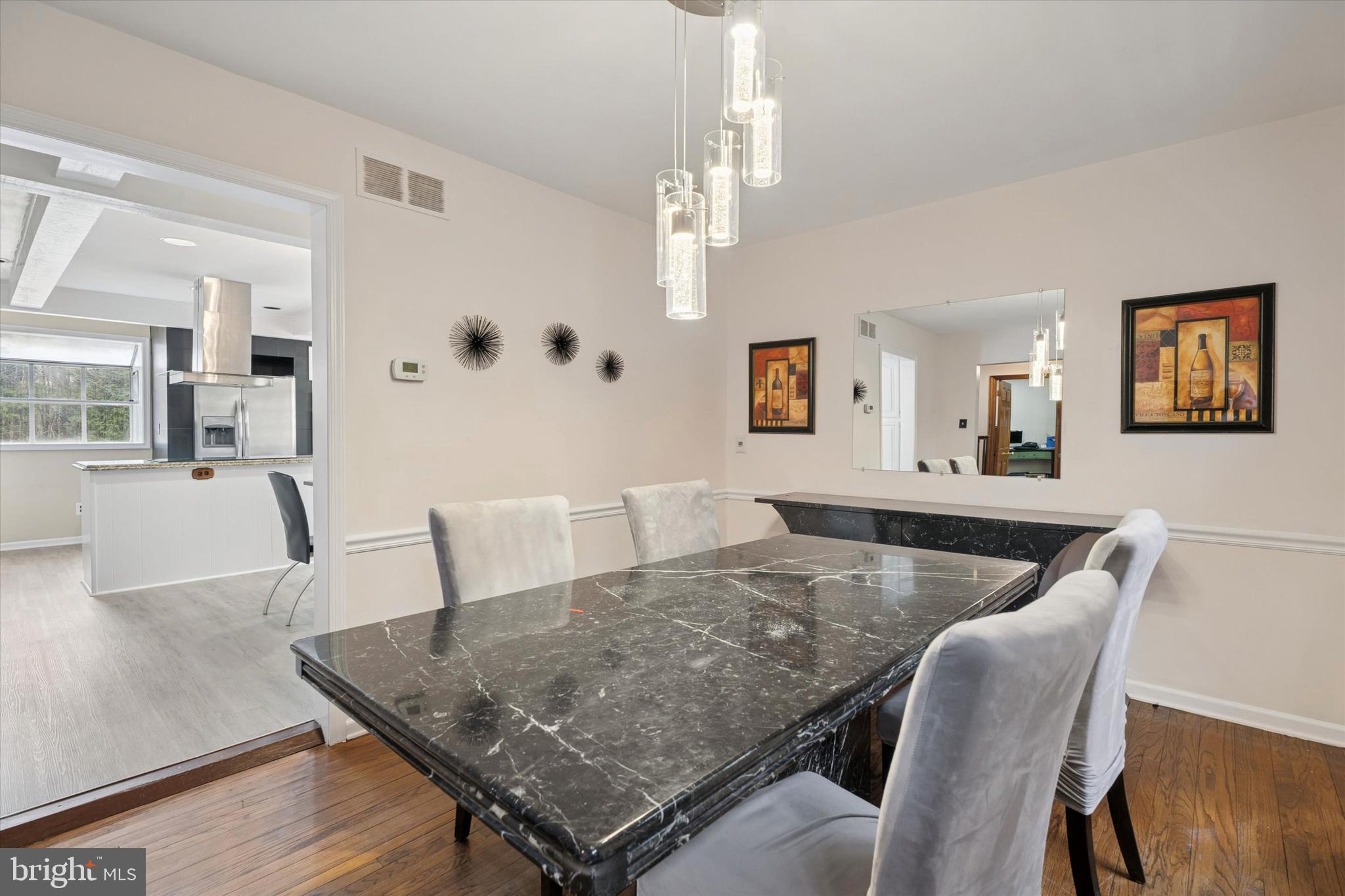 125 Red Lion Road Huntingdon Valley, PA 19006 - Photo 11 of 32 a view of a dining room with furniture and wooden floor