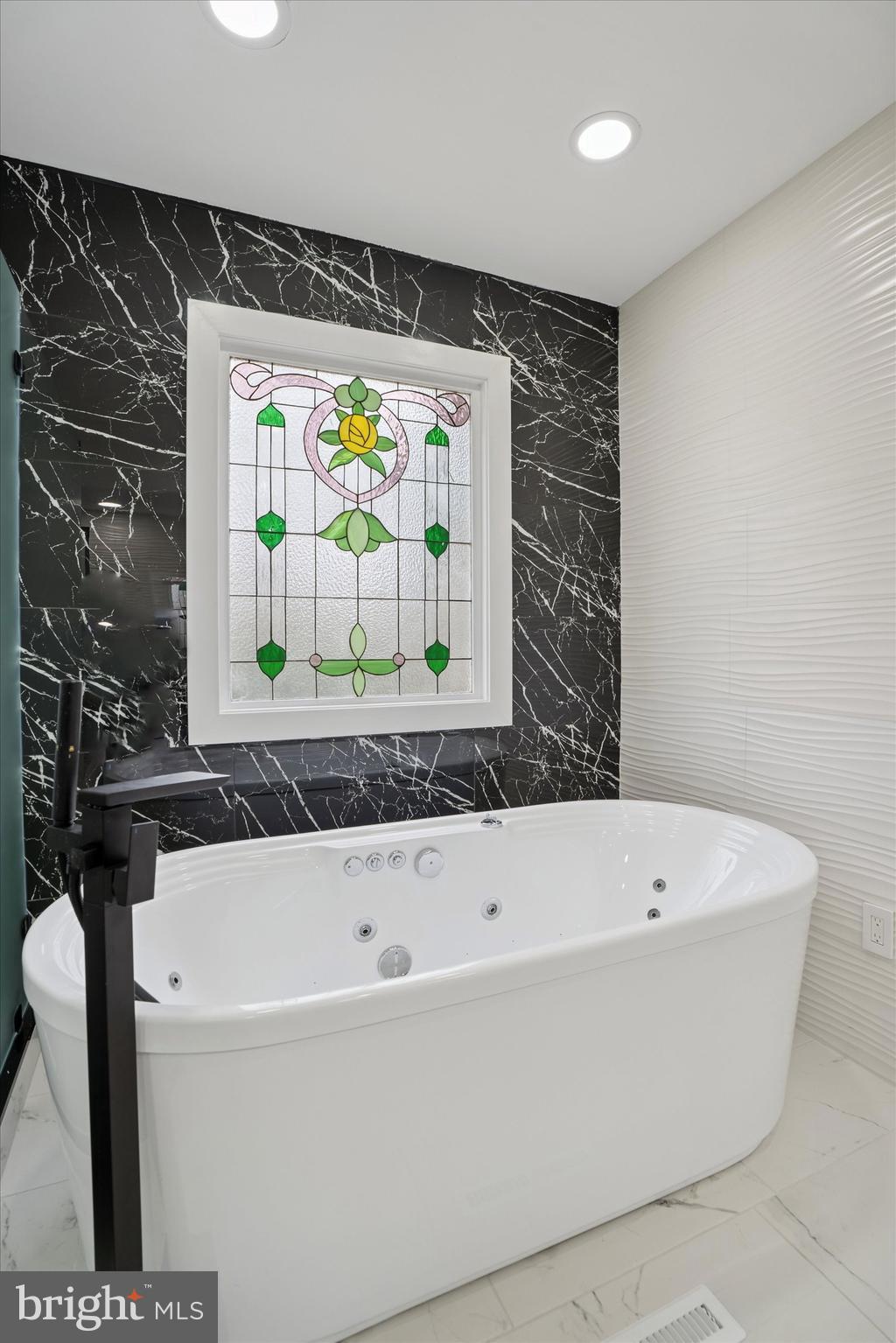 125 Red Lion Road Huntingdon Valley, PA 19006 - Photo 20 of 32 a bathroom with a bathtub and a shower