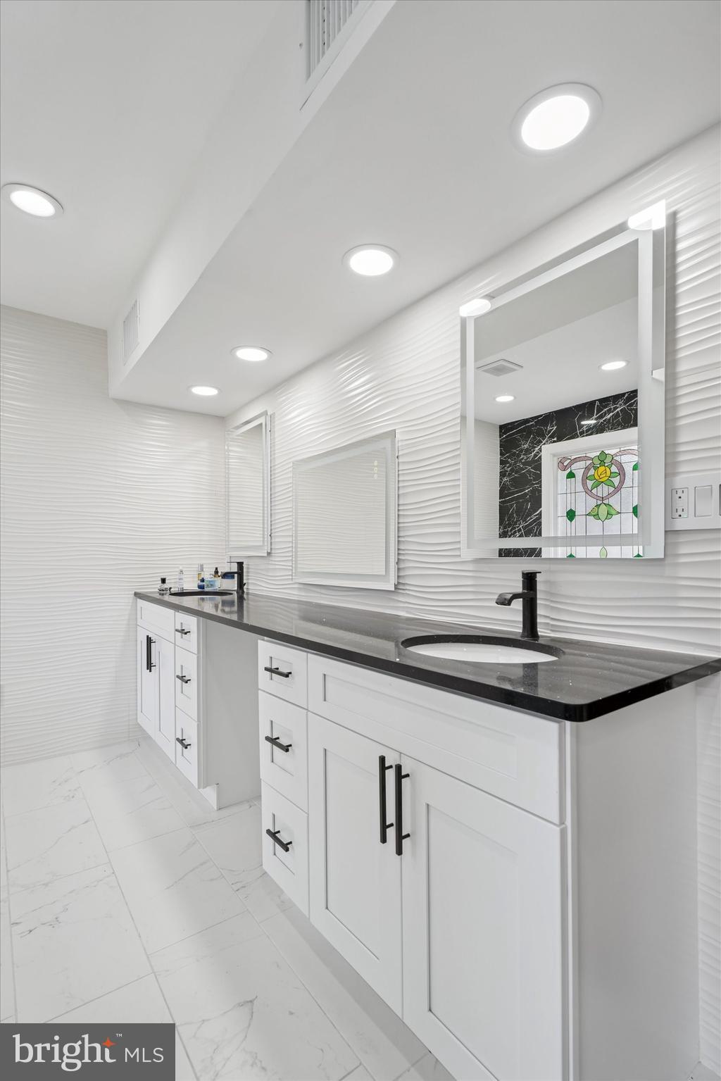 125 Red Lion Road Huntingdon Valley, PA 19006 - Photo 21 of 32 a kitchen with white cabinets and sink