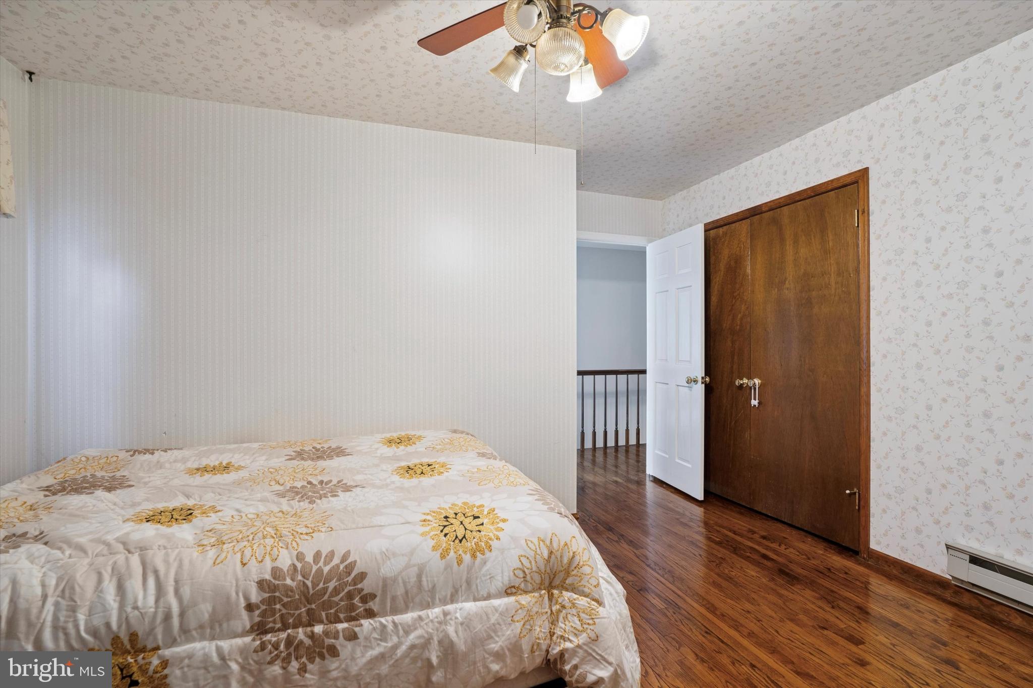 125 Red Lion Road Huntingdon Valley, PA 19006 - Photo 25 of 32 a bedroom with a bed and a chandelier