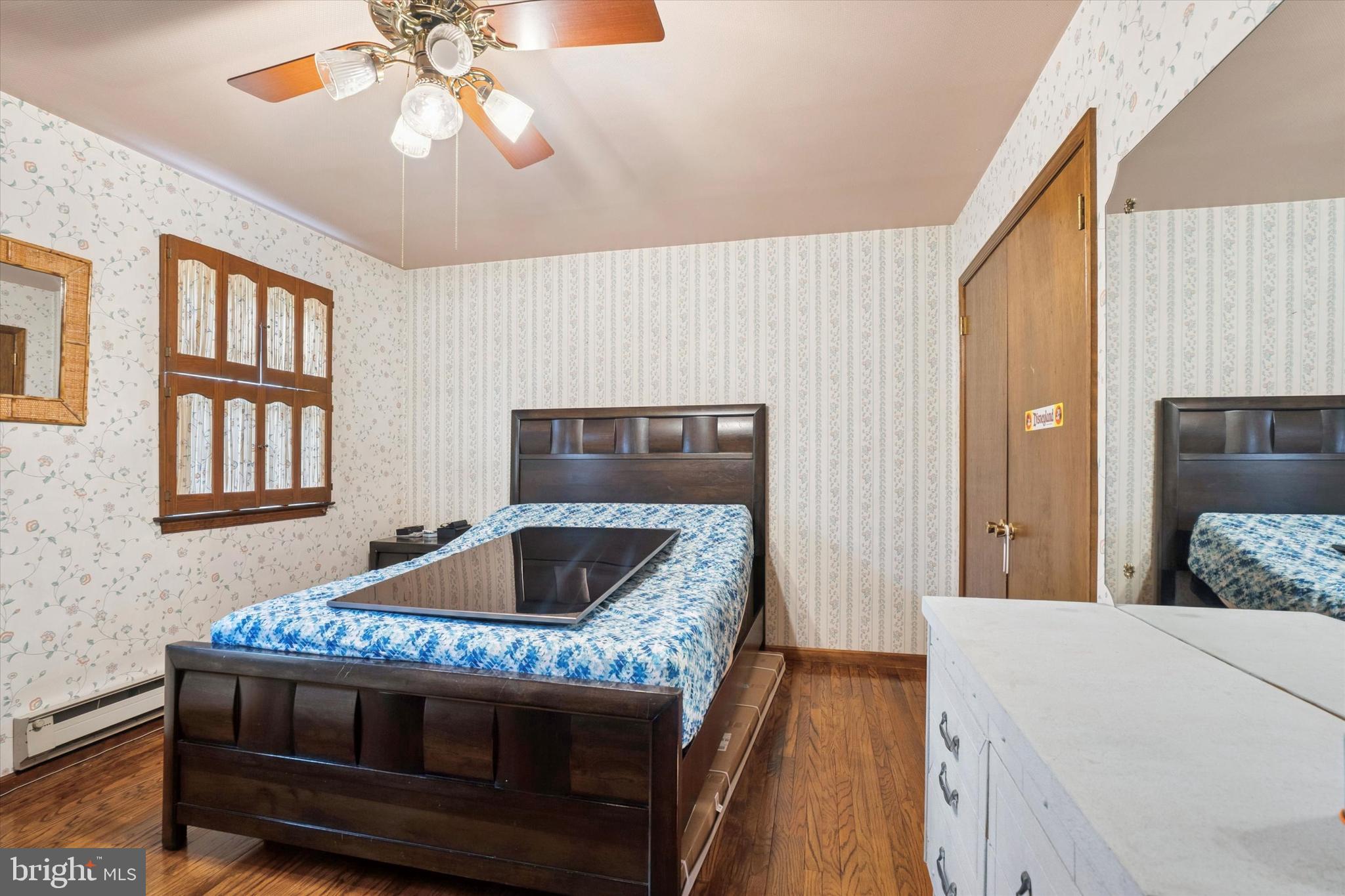 125 Red Lion Road Huntingdon Valley, PA 19006 - Photo 26 of 32 a bedroom with a bed and a dresser next to a window