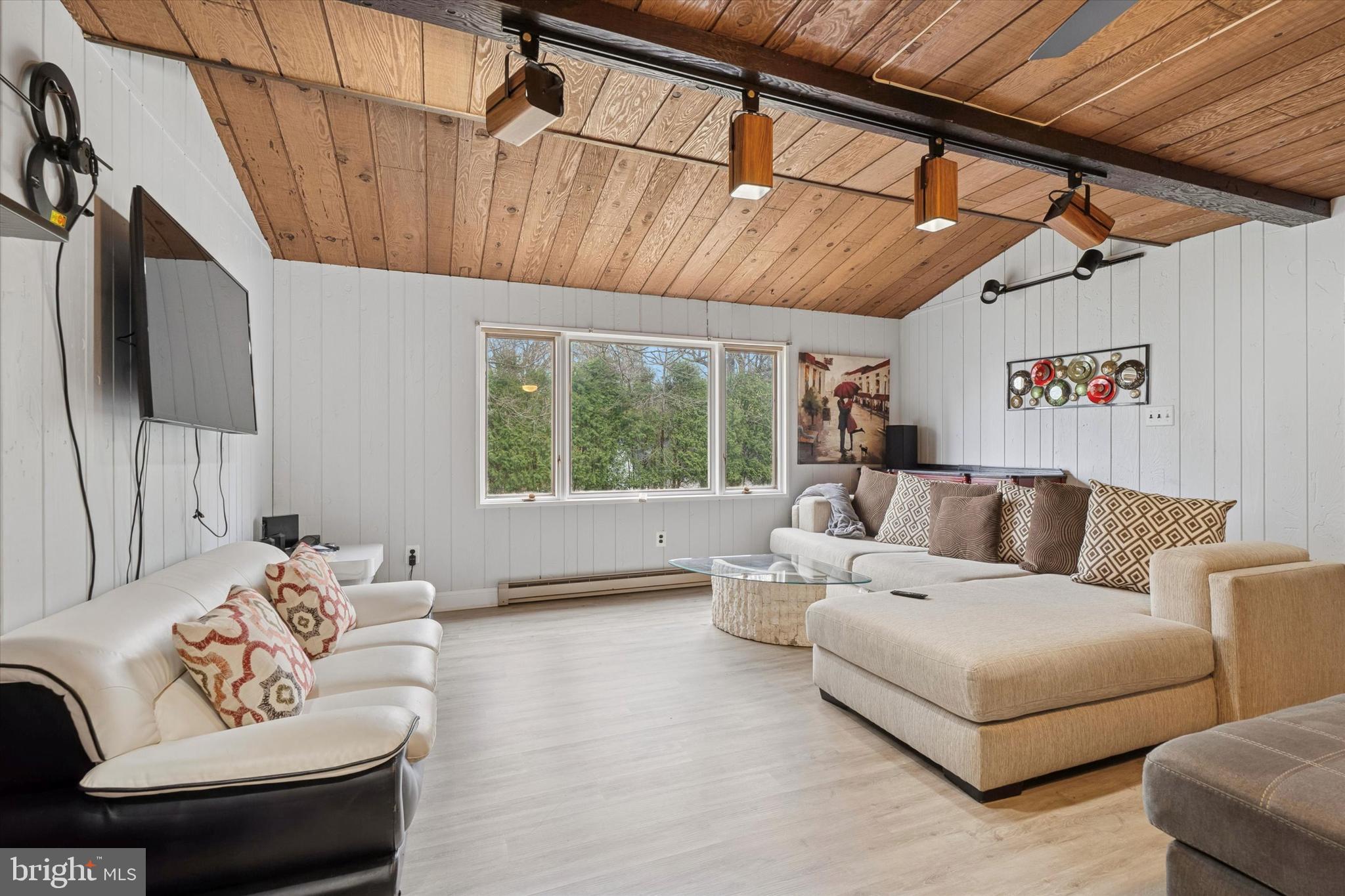 125 Red Lion Road Huntingdon Valley, PA 19006 - Photo 6 of 32 a living room with furniture and a flat screen tv