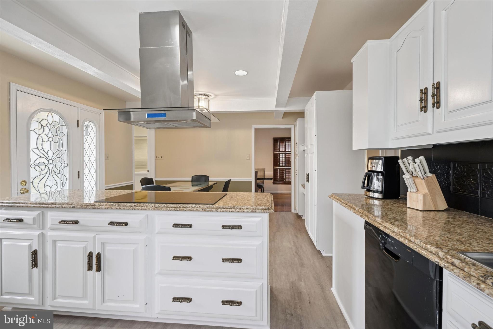 125 Red Lion Road Huntingdon Valley, PA 19006 - Photo 7 of 32 a kitchen with stainless steel appliances granite countertop a sink stove and cabinets