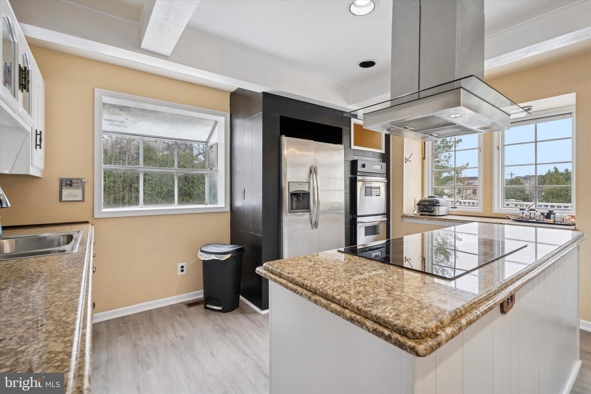 125 Red Lion Road Huntingdon Valley, PA 19006 - Photo 8 of 32 a kitchen with stainless steel appliances granite countertop a sink and a refrigerator