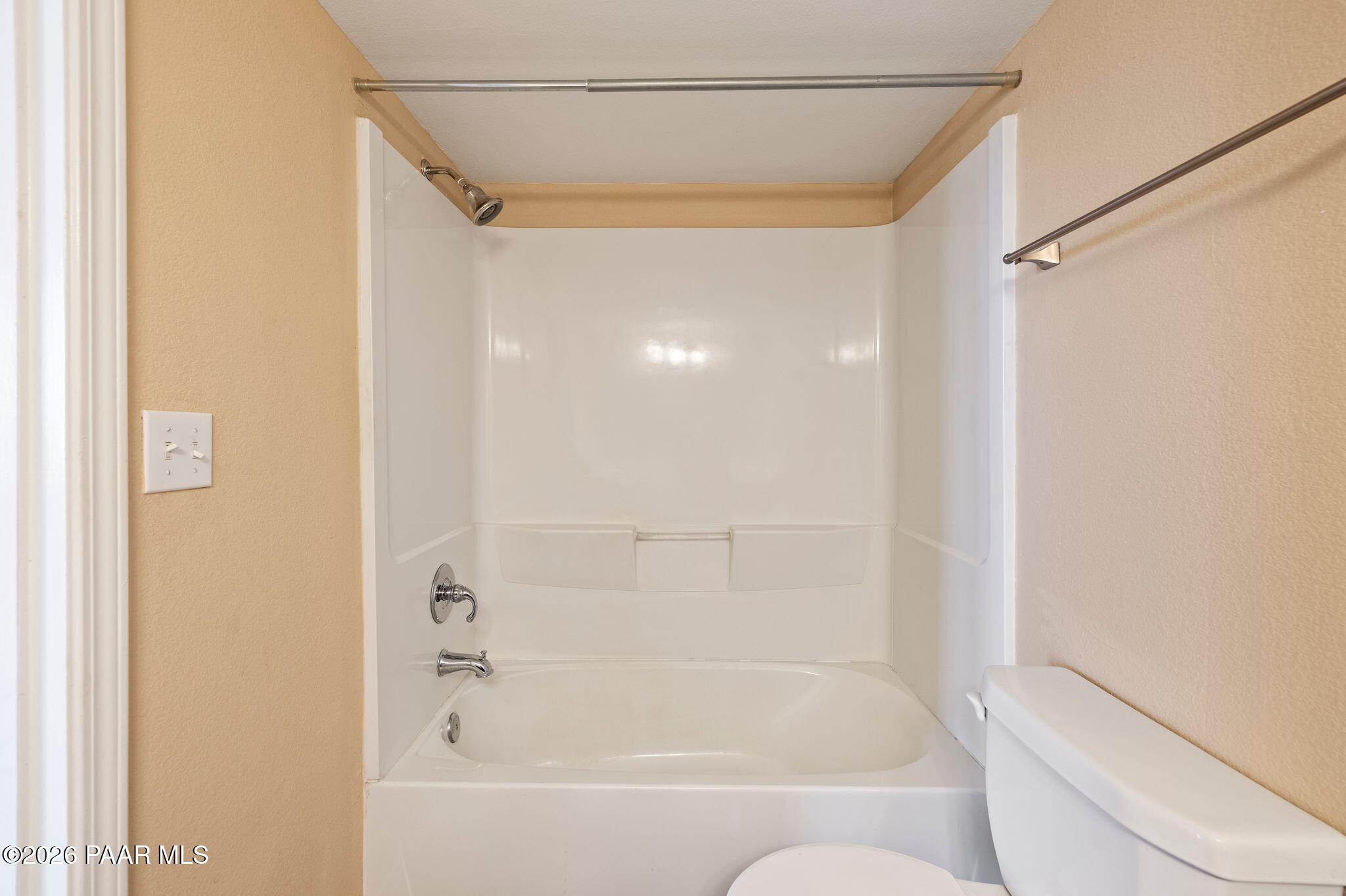 1001 East Goodwin Street, Unit 101 Prescott, AZ 86303 - Photo 13 of 23 a bathroom with a bathtub and a shower