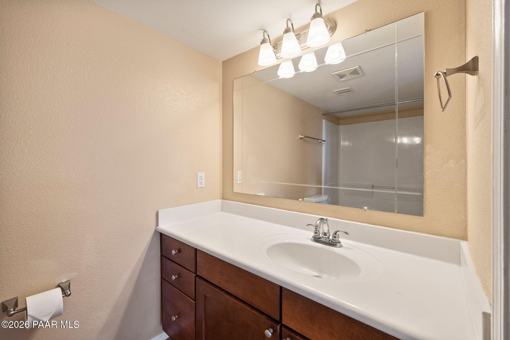1001 East Goodwin Street, Unit 101 Prescott, AZ 86303 - Photo 15 of 23 a bathroom with a sink and a mirror