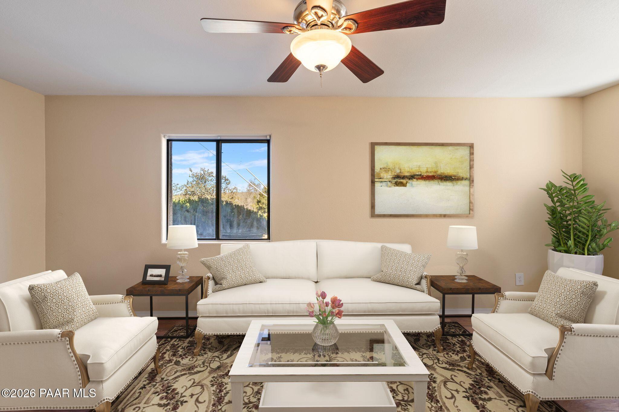 1001 East Goodwin Street, Unit 101 Prescott, AZ 86303 - Photo 4 of 23 a living room with furniture and a large window