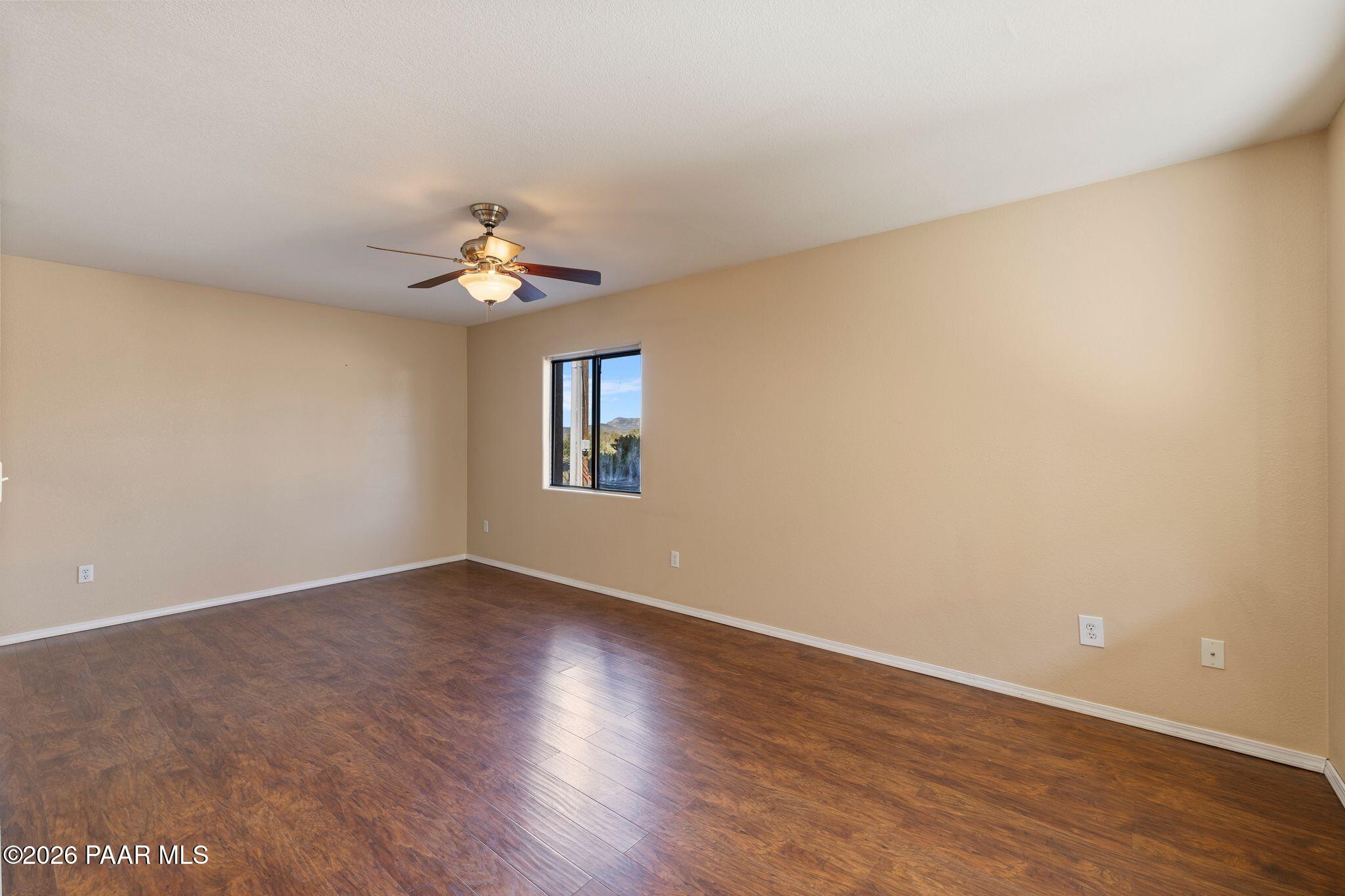 1001 East Goodwin Street, Unit 101 Prescott, AZ 86303 - Photo 8 of 23 wooden floor in an empty room with a window