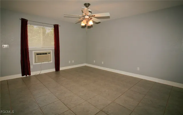 a view of an empty room with a window