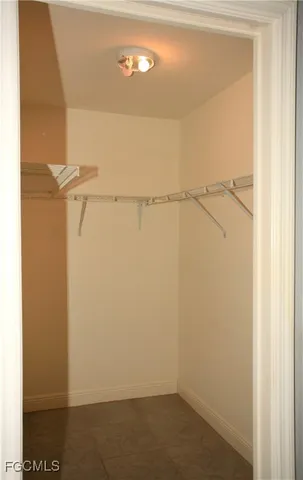 a bathroom with a toilet a sink and a window