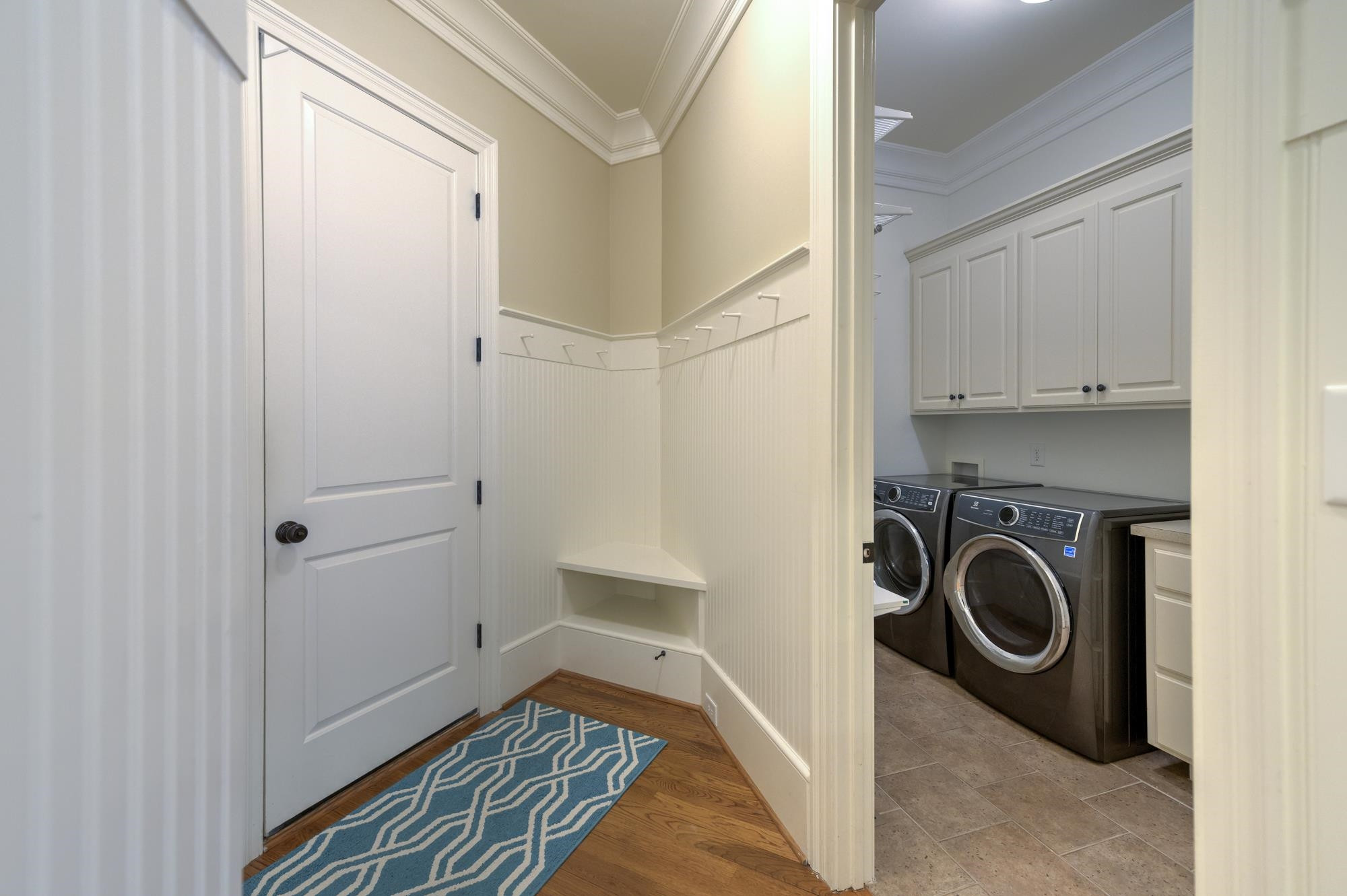 1417 Caistor Lane Raleigh, NC 27614 - Photo 16 of 42 Coming in from the 3-car garage, this mud room/laundry area gives you space to drop the shoes and stuff without cluttering up the kitchen