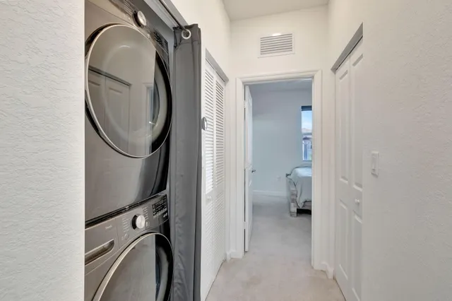 a view of a bathroom with a sink and a mirror