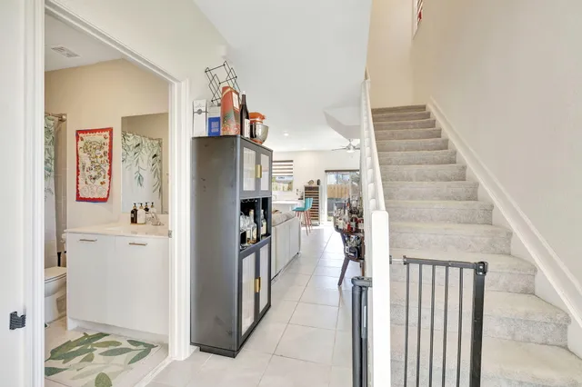 a view of a hallway with wooden floor and entryway