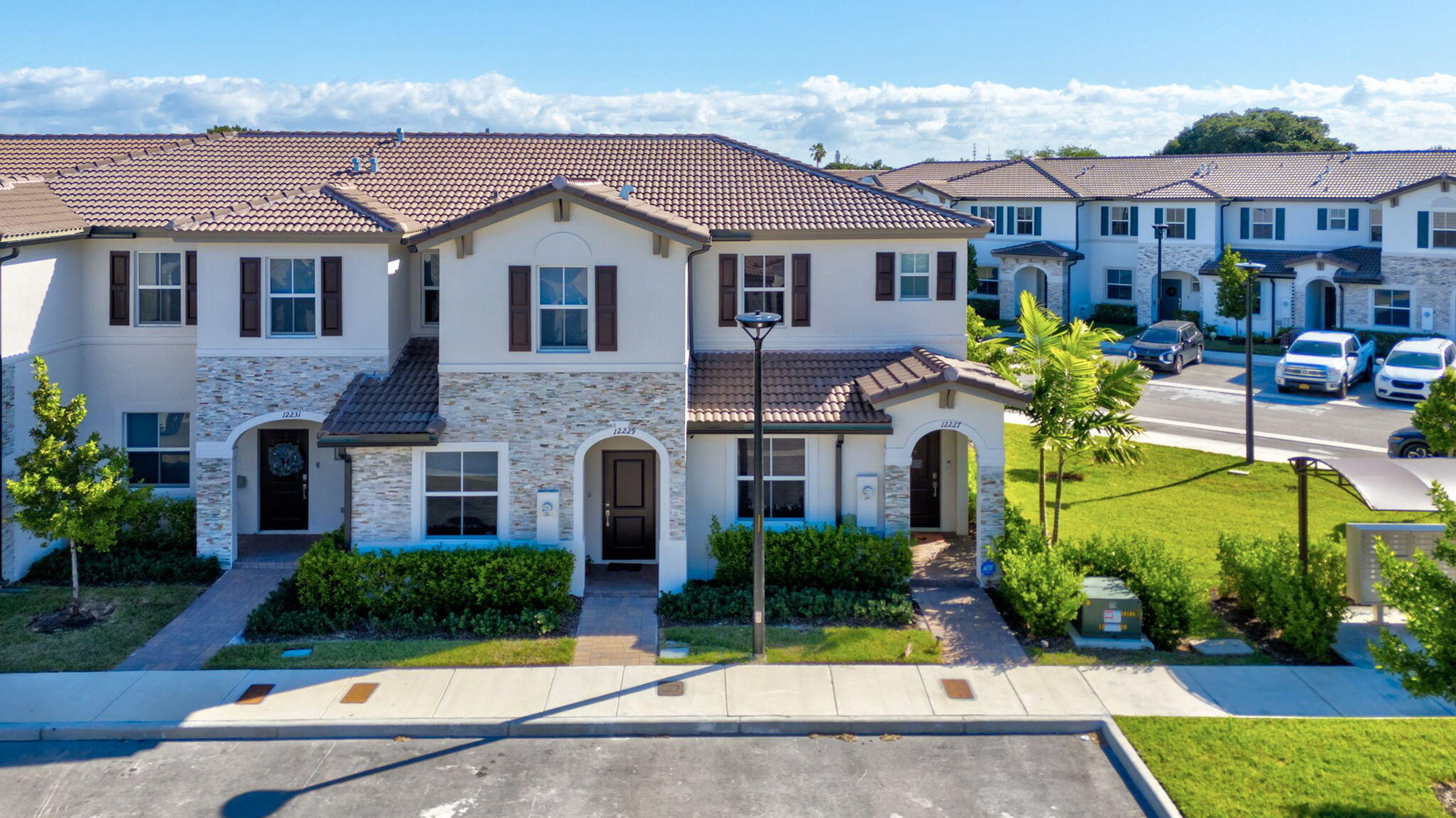 12227 Northwest 23rd Avenue Miami, FL 33167 - Photo 38 of 52 a front view of a house with garden