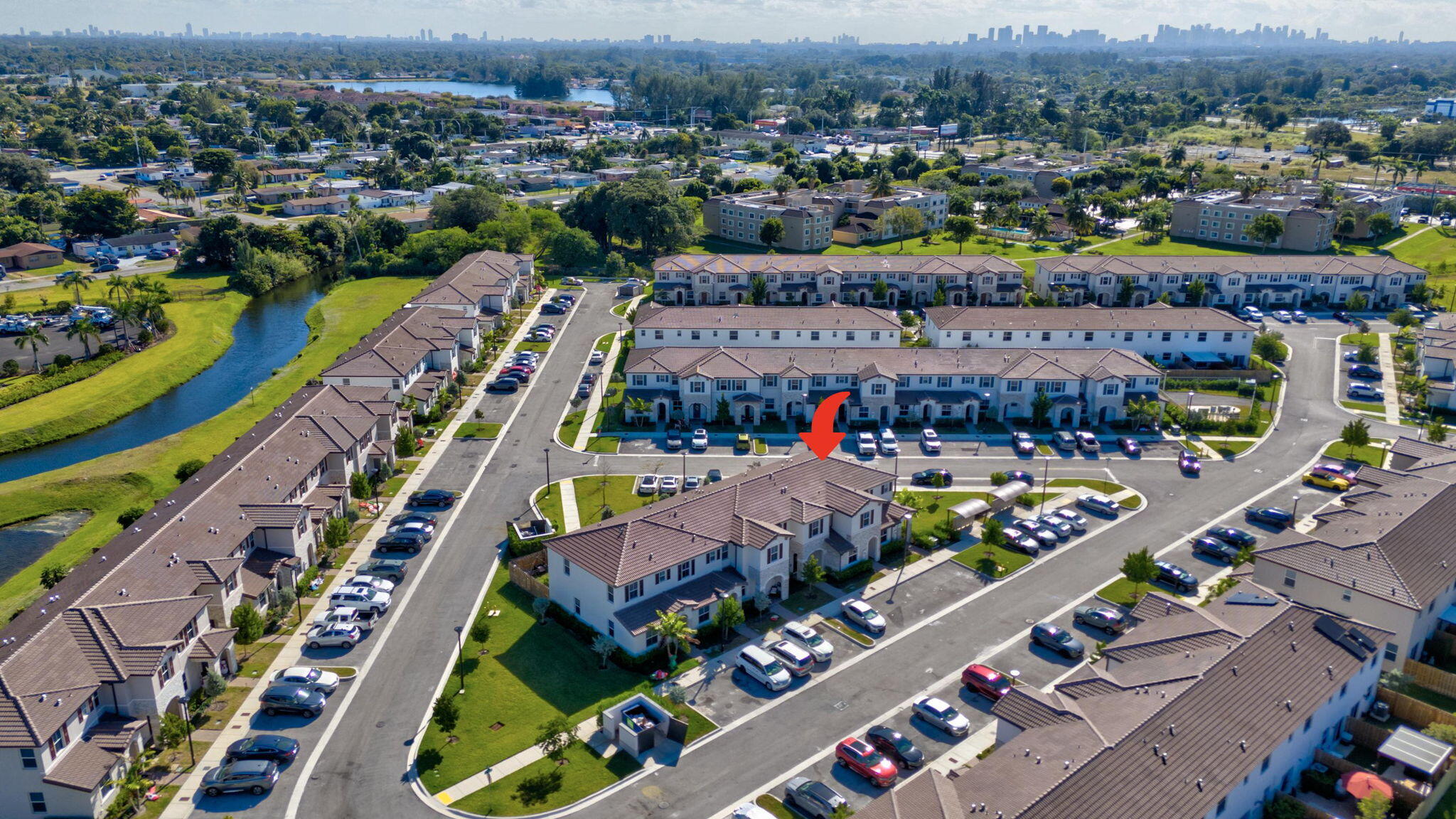 12227 Northwest 23rd Avenue Miami, FL 33167 - Photo 42 of 52 an aerial view of lake and residential houses