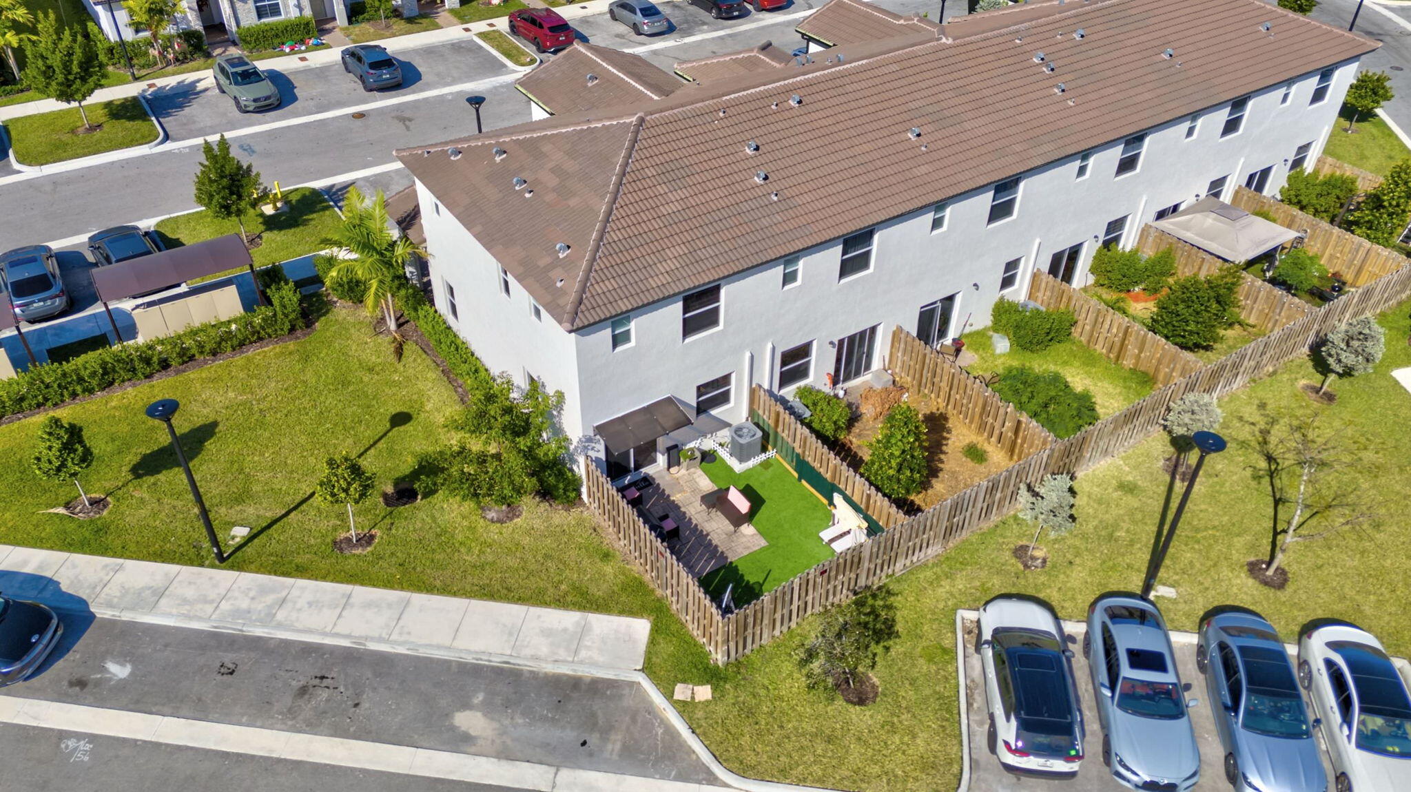 12227 Northwest 23rd Avenue Miami, FL 33167 - Photo 46 of 52 an aerial view of a residential apartment building with a yard