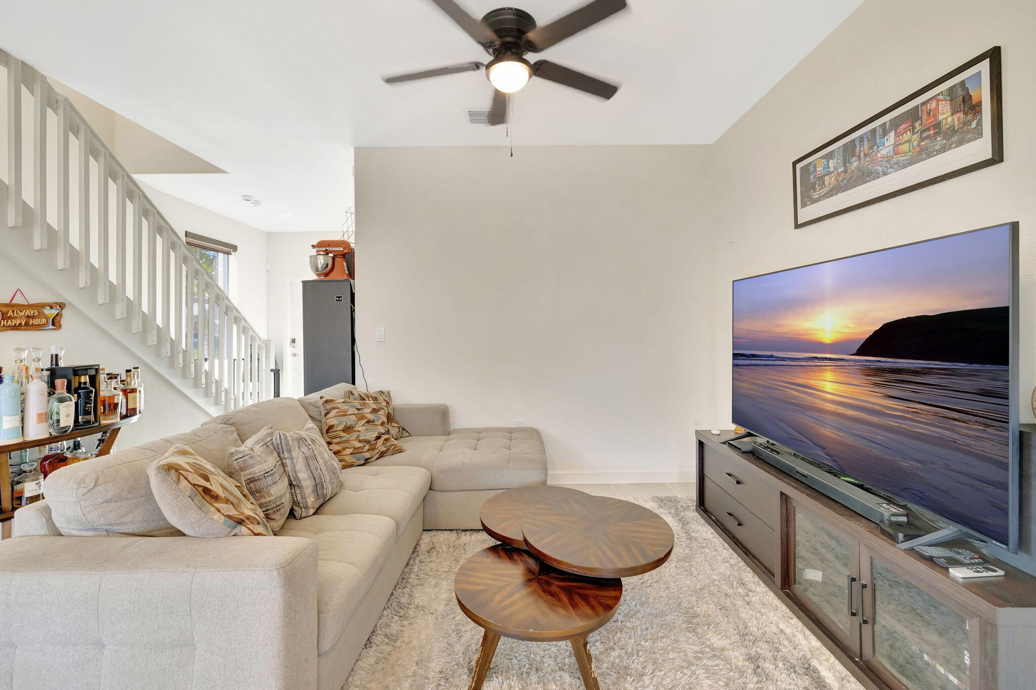 12227 Northwest 23rd Avenue Miami, FL 33167 - Photo 6 of 52 a living room with furniture and a flat screen tv