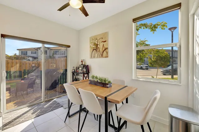 a view of a dining room with furniture window and outside view