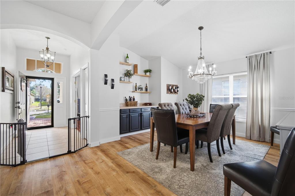 6325 Bridgecrest Drive Lithia, FL 33547 - Photo 34 of 72 a view of a dining room with furniture window and wooden floor
