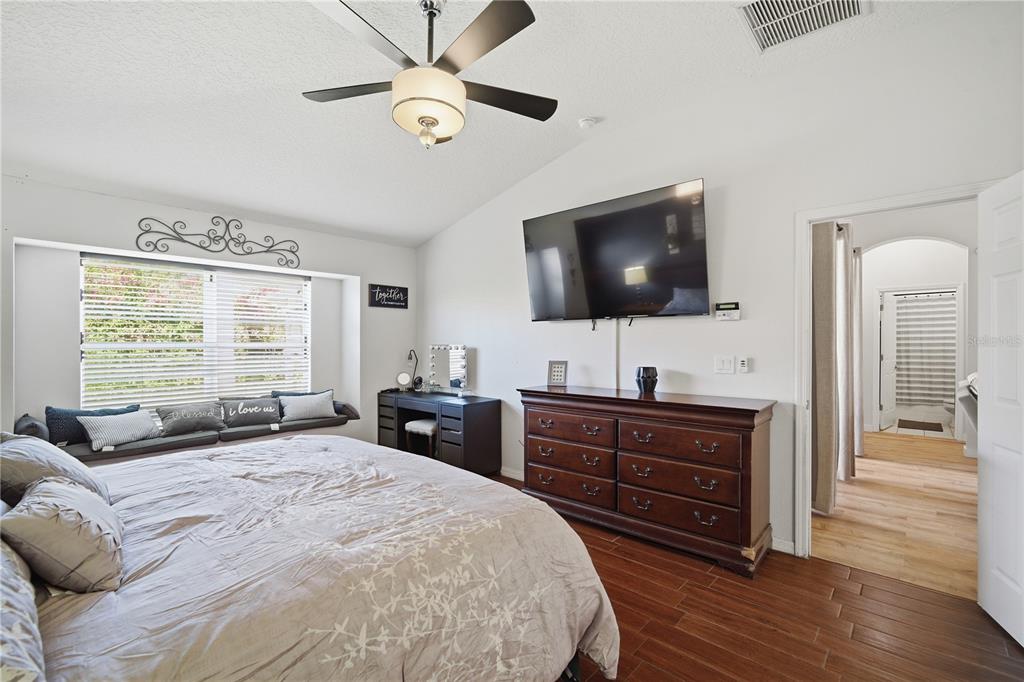 6325 Bridgecrest Drive Lithia, FL 33547 - Photo 38 of 72 a bedroom with a bed and a flat screen tv