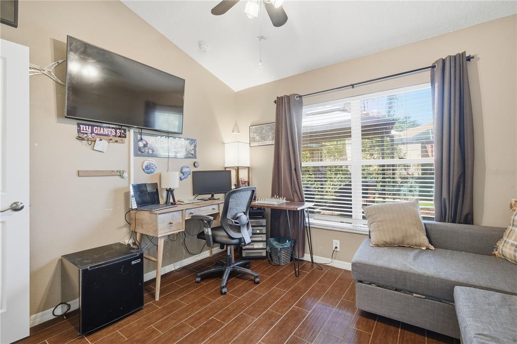 6325 Bridgecrest Drive Lithia, FL 33547 - Photo 50 of 72 a living room with furniture and a flat screen tv