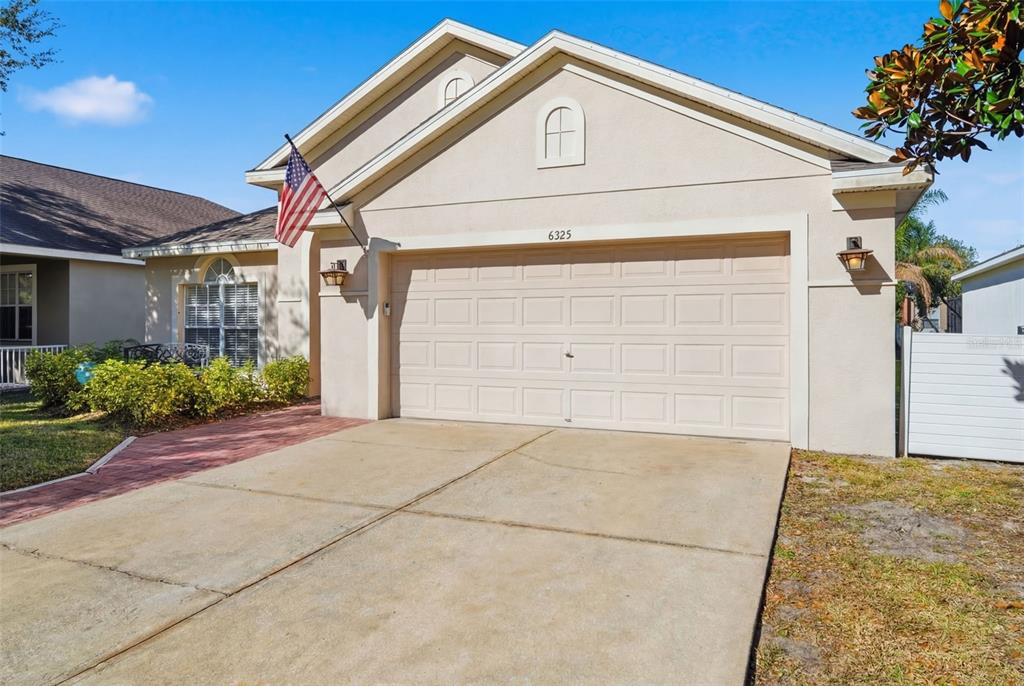 6325 Bridgecrest Drive Lithia, FL 33547 - Photo 5 of 72 a front view of a house with a yard and garage