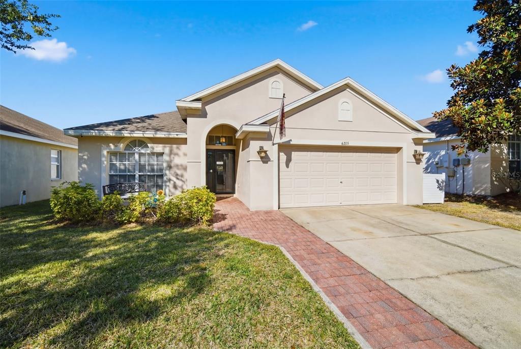 6325 Bridgecrest Drive Lithia, FL 33547 - Photo 6 of 72 a front view of a house with a yard and garage